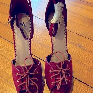 Never worn burnt red heel.